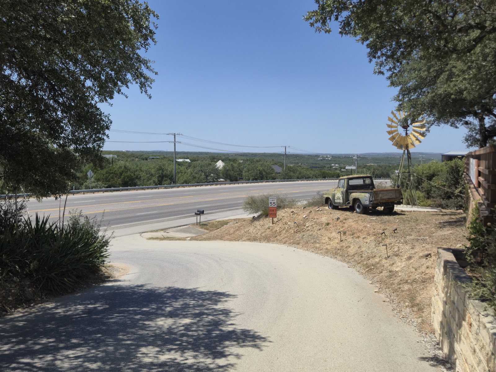 The drive down from Poodie's to Highway 71 West, with the Hill Country beyond