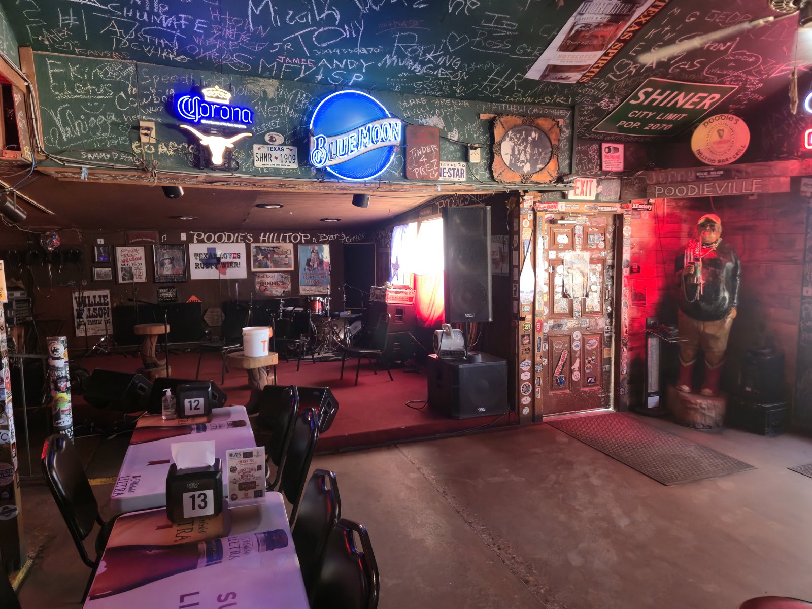 The indoor stage, with the venue's signed and graffitied ceiling overhead